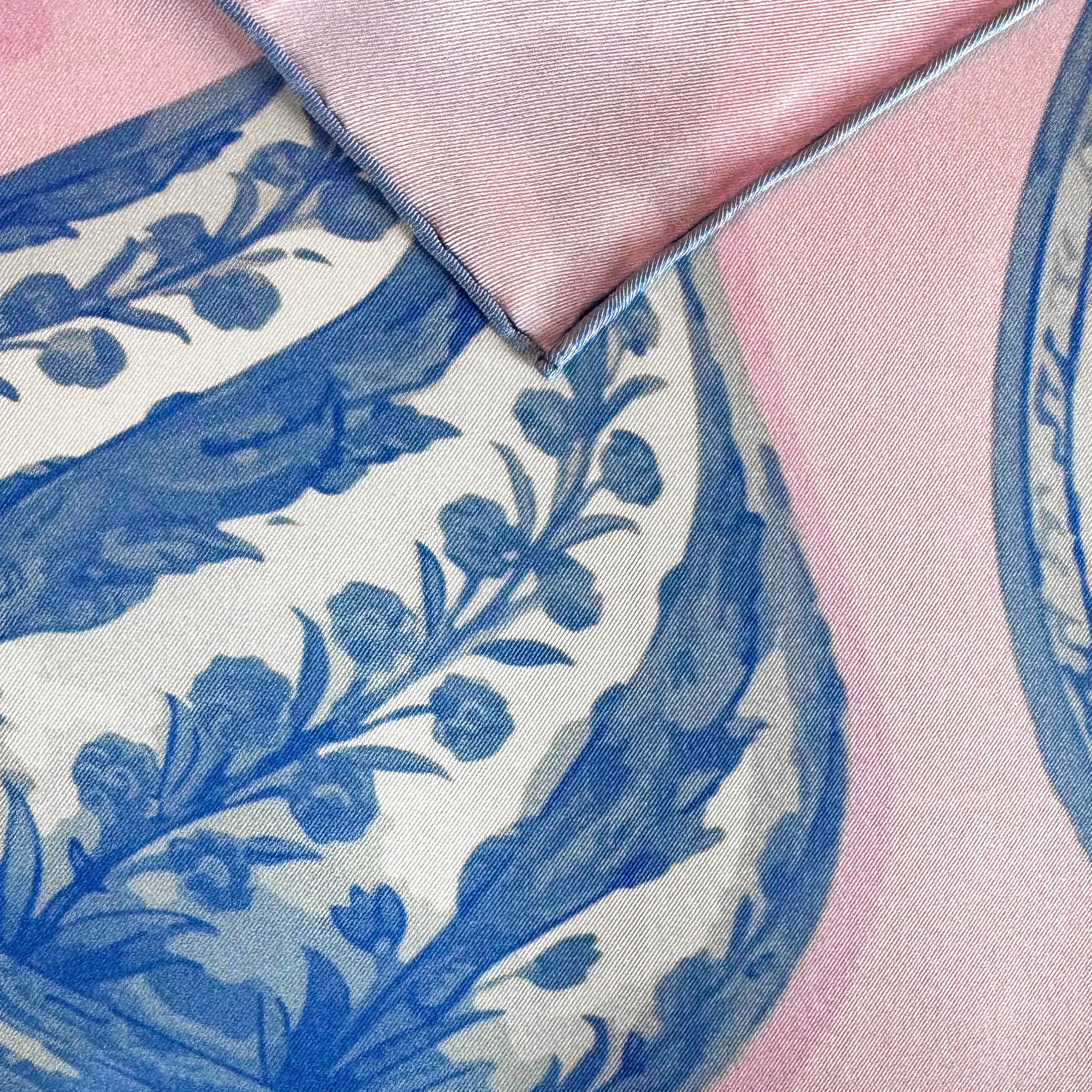 Detail of the Iznik Rosé silk scarf showing hand-painted Iznik ceramic motifs and the hand-rolled hem.